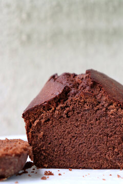Perfectly baked homemade chocolate sponge cake using Flour, sugar, butter, baking powder, salt, eggs, and cocoa powder. Copy space. bakery concept. Moist sponge cake slice with texture.