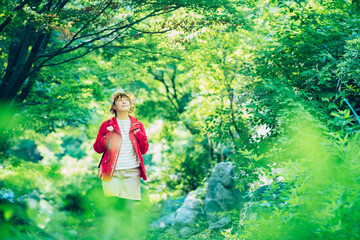 Woman walking in the fresh green mountain