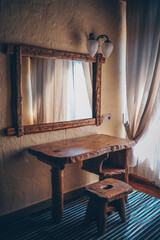 Old vintage interior with wood table, chair and antique mirror
