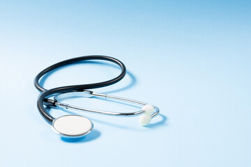 Fototapeta premium Close up view of stethoscope on the blue background.