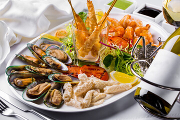Pieces of fried fish, mussels, shrimps, fish fillets