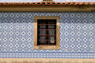detail of the facade covered with azulejos of the church Santa Marinha in Cortegaca, Ovar district, Portugal
