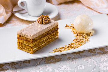A slice of honey cake with walnut pieces