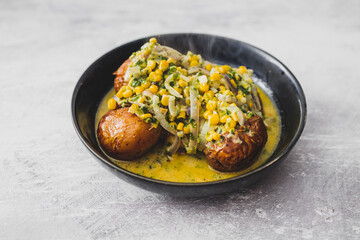 healthy plant-based food, vegan roasted potatoes with creamy corn and spinach sauce