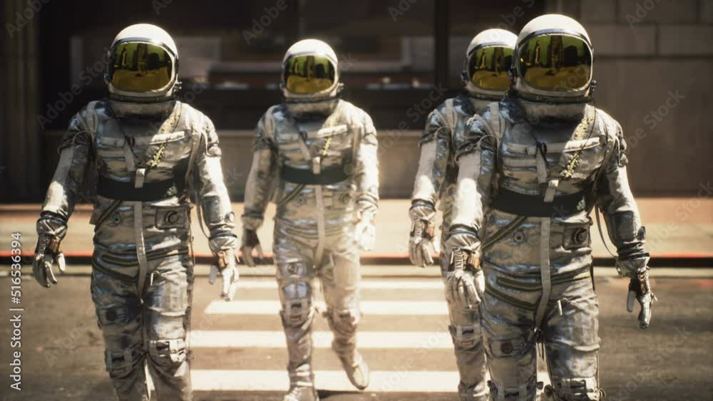 Wall mural a team of astronauts are walking around the city in between flights on their spaceship. astronauts o