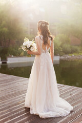Fototapeta na wymiar Bride with white wedding bouquet