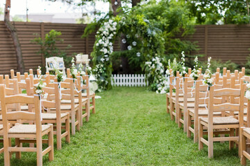 Green garden wedding arch with flowers