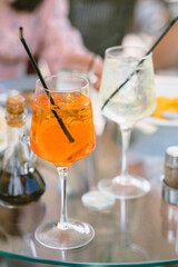 Summer refreshing cocktails on dinner table outdoors. Vacation, relax concept. Summer lifestyle.