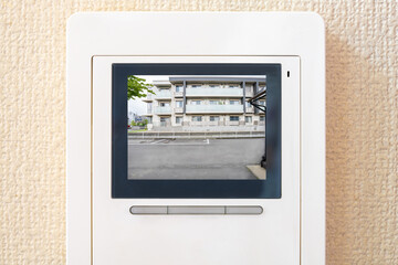 Obraz premium 住宅街の風景が合成されたインターホン