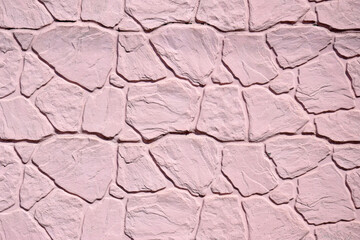 The light pink stone wall texture. Background.