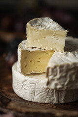 Camembert cheese on a wooden board