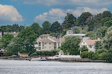 
Summertime view of houses on islands in the archipelago outside of Stockholm, the capital of Sweden, one of the Nordic countries along the Baltic Sea in Scandinavia, Europe.  - 516543187