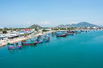 Naklejka na ściany i meble Landscape photo: fishing boats along the coast of Vinh Hy Bay. Time: June 20, 2022. Location: Phan Rang City. 