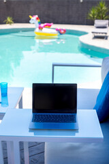 Fototapeta na wymiar working by the pool, home office, pool office for the summer