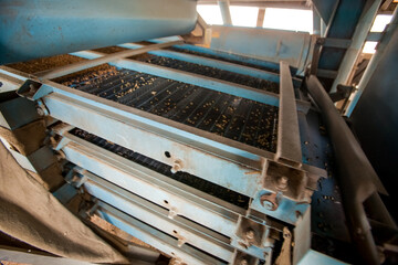 Agro manufacturing plant equipment. Elevator granary warehouse. Harvest time