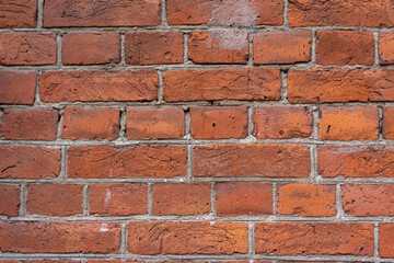 Obraz premium Empty brick red wall. background of a old brick house.
