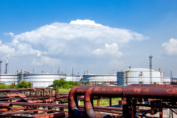 Refinery factory oil storage tank and pipelines. Oil and gas petrochemical industrial background