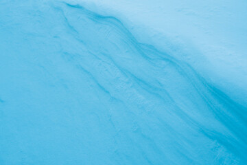 Abstract blur blue bokeh. Natural Winter Christmas background with heavy snowfall, snowflakes