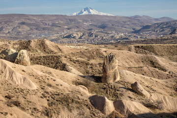 Hills in Cappadocia with Mt Erciyes in the background.