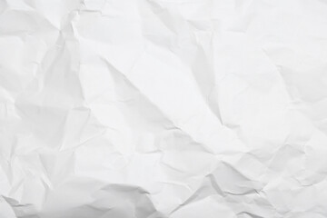 Sheet of white crumpled paper as background, closeup