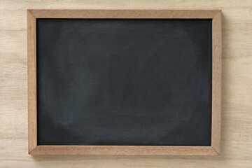 Blackboard on a wood background