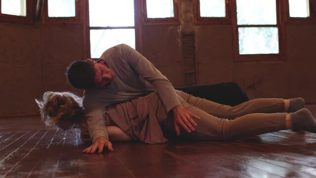 Dancer improvising an intimate dance on the floor. contact with the dancer, on the floor, dance performance, improvisation
