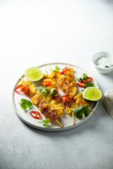 Healthy pineapple skewers with chili and lime