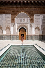 Woman standing in the Ali Ibn Yusuf mosque and madrasah © Witold