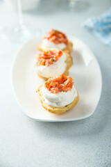 Homemade profiteroles with salmon and cream cheese