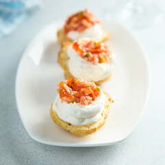 Homemade profiteroles with salmon and cream cheese