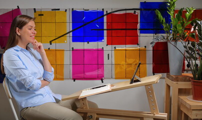 Woman designer doing online learning or teaching and working with color palette.
