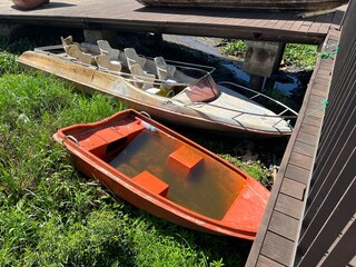 Beautiful Calm Water Reflection Lake and Fisherman working fishing on Boats with Blue Sky and Sunny Weather Clear Horizon