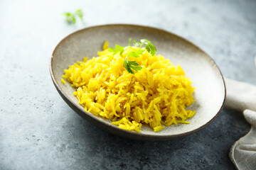 Healthy vegan turmeric rice with fresh parsley