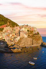 Fototapeta na wymiar Stunning view of Manarola, the second village of the Cinque Terre coming from La Spezia. Manarola is the most picturesque village, made up of colorful tower-houses. La Soezia, Liguria, Italy.