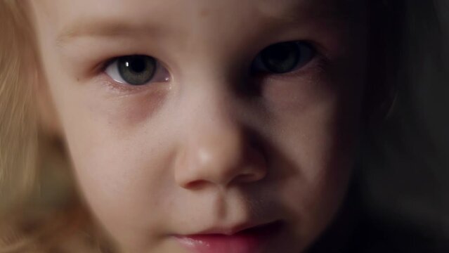 closeup of cute baby face, charming little girl, green eyed caucasian child