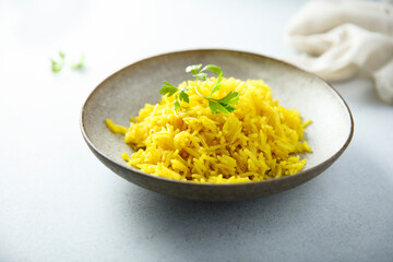 Healthy vegan turmeric rice with fresh parsley