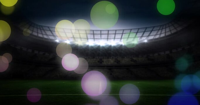 Animation of failing spots and glowing lights over football stadium
