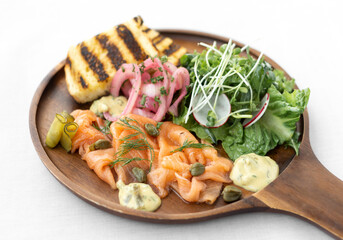 salmon gravlax platter with salad and toast in sweden