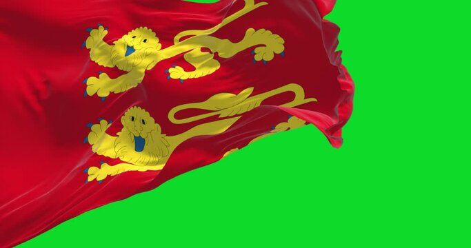 The flag of Normandy region waving in the wind isolated on a green background