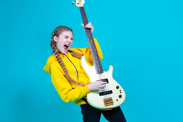 Musical Concepts. One Winsome Caucasian Female Guitar Player With White Bass Guitar Holding...