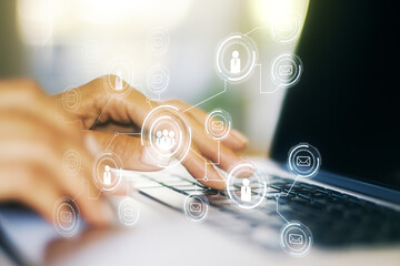 Social network concept with hands typing on laptop on background. Multiexposure