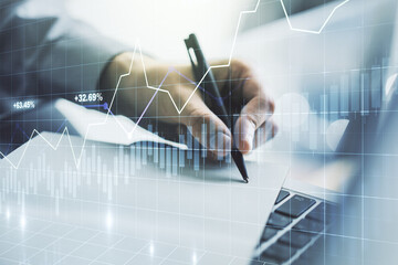 Abstract creative financial graph with hand writing in diary on background, financial and trading concept. Multiexposure