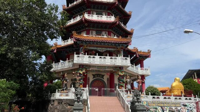 Tuaran, July 11, 2022 - A Buddhist temple stands upright and high. Famous temple in Tuaran. Video taken up close.