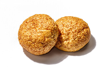Fresh buns with sesame isolated on a white background. An indispensable ingredient for burgers