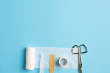 First aid kit, Medical bandages with scissors and sticking plaster. Medical equipment.