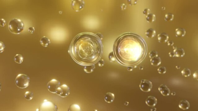 A macro shot of many gold bubbles rising in water on a gold background. Super slow motion beautiful shiny blobs or drops of moisturizing bubble 3D animation find a special extract.