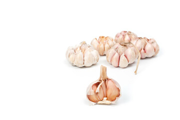 Several large heads of garlic, shot against a white background.