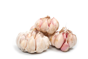 Several large heads of garlic, shot against a white background.