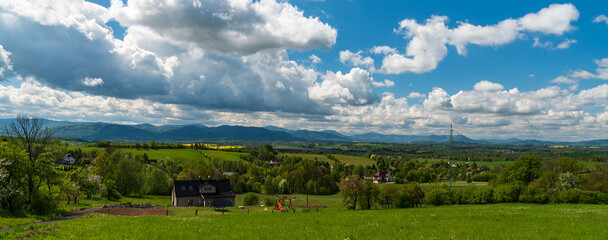Obraz premium Rural landscape and Moravskoslezske Beskydy mountains from view point bellow Babi hora hill in Czech republic