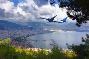 The plane flies over the Mediterranean Sea over the Turkish resort towns.